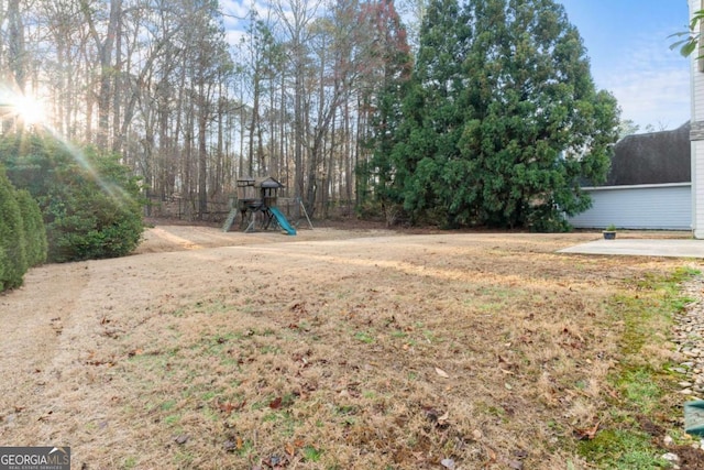 675 Timber Ives Dr, Dacula, GA 30019 - view of green lawn featuring a playground