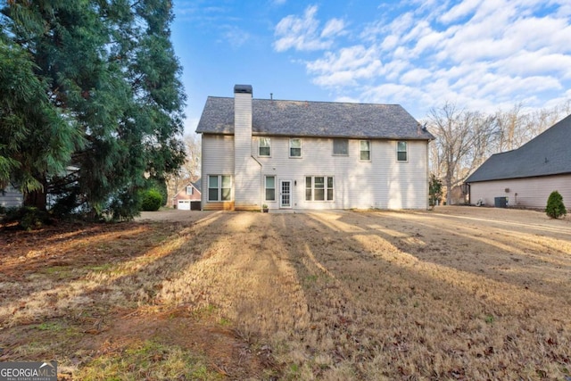 675 Timber Ives Dr, Dacula, GA 30019 - back of house featuring a chimney