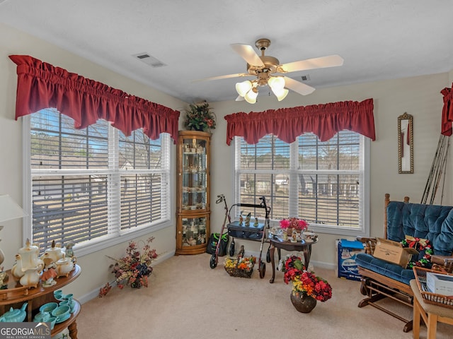 rec room featuring visible vents, carpet floors, baseboards, and ceiling fan
