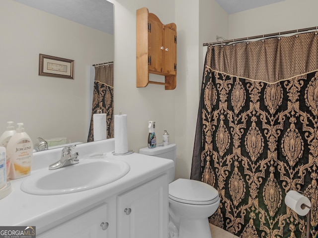full bath with vanity and toilet
