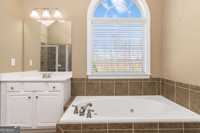 full bathroom featuring visible vents, tile patterned flooring, vanity, baseboards, and a bath