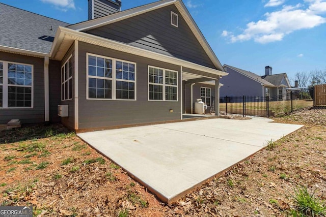 view of yard featuring a fenced backyard, a trampoline, and a patio