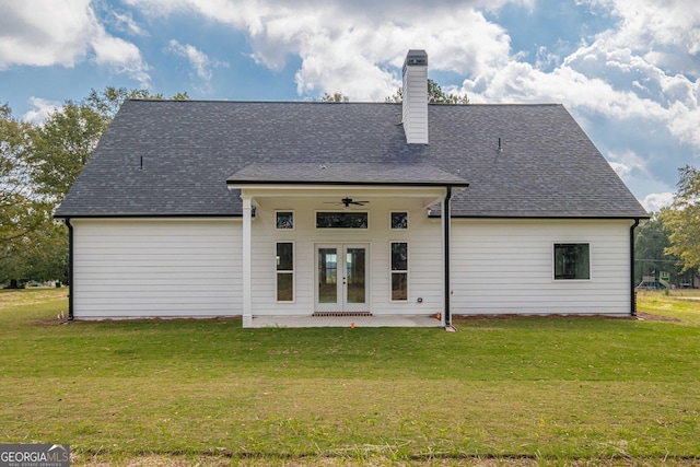 back of property featuring french doors, a yard, a patio area, and a chimney
