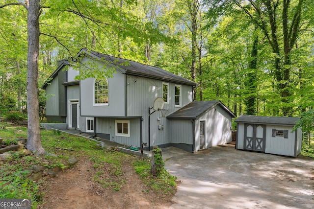 1291 Marcelle Heights Pl, Norcross, GA 30093 - view of property exterior with a storage unit and an outdoor structure
