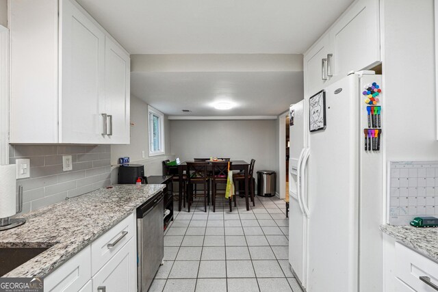 1291 Marcelle Heights Pl, Norcross, GA 30093 - kitchen featuring white refrigerator with ice dispenser, dishwasher, white cabinets, and backsplash