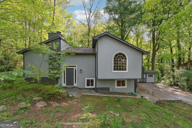 1291 Marcelle Heights Pl, Norcross, GA 30093 - back of house featuring a chimney