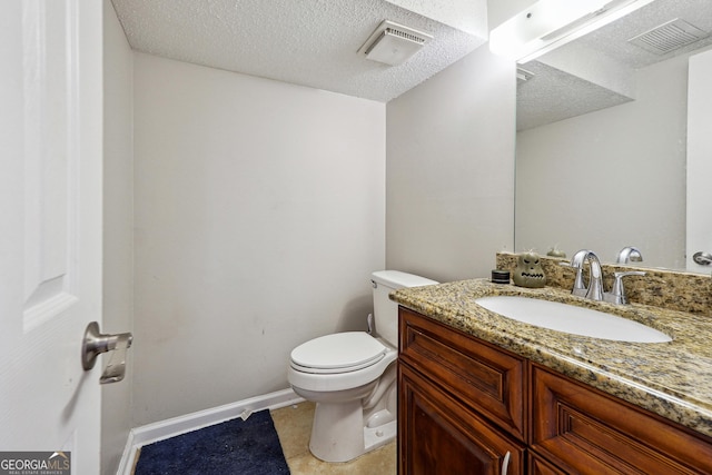 half bathroom with a textured ceiling, visible vents, toilet, and vanity