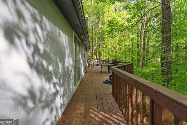 deck with a wooded view