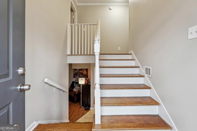1291 Marcelle Heights Pl, Norcross, GA 30093 - stairs with crown molding, wood finished floors, and baseboards