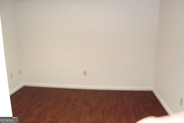 empty room featuring baseboards