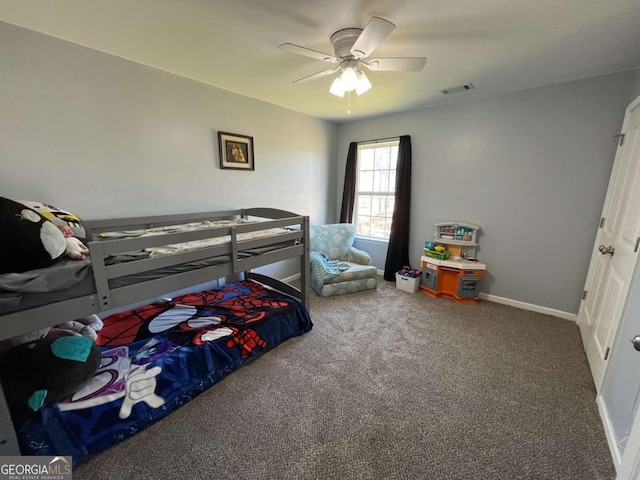 bedroom with visible vents, baseboards, ceiling fan, and carpet flooring