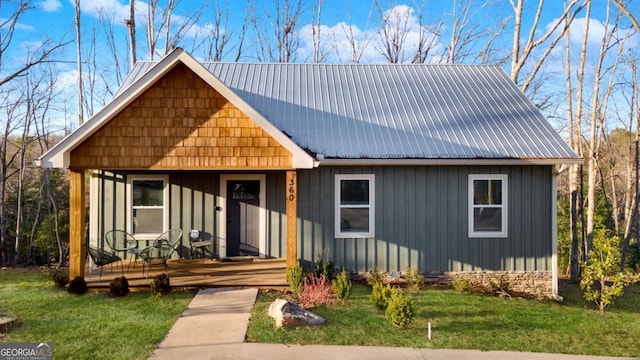 360 Prince Dr, Morganton, GA 30560 - view of front of home with board and batten siding, metal roof, and a front lawn