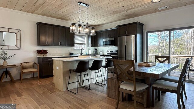 360 Prince Dr, Morganton, GA 30560 - dining area with visible vents, light wood-style floors, and wood ceiling