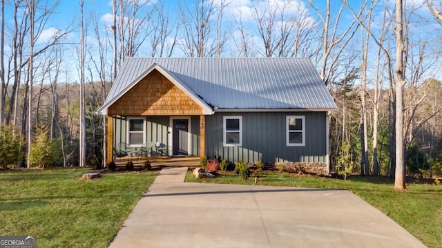 360 Prince Dr, Morganton, GA 30560 - view of front of property featuring covered porch, metal roof, and a front yard