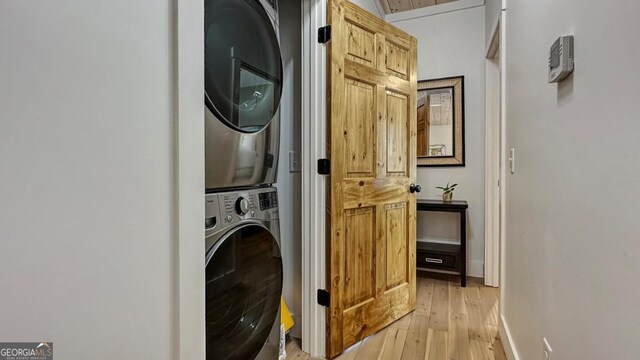 360 Prince Dr, Morganton, GA 30560 - washroom featuring stacked washer / drying machine, baseboards, laundry area, and light wood finished floors