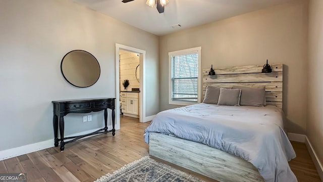 360 Prince Dr, Morganton, GA 30560 - bedroom featuring visible vents, ensuite bath, wood finished floors, baseboards, and ceiling fan
