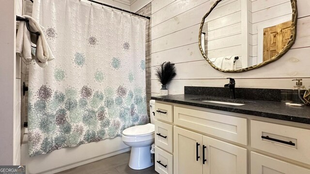 360 Prince Dr, Morganton, GA 30560 - full bathroom with wooden walls, shower / tub combo with curtain, vanity, and toilet