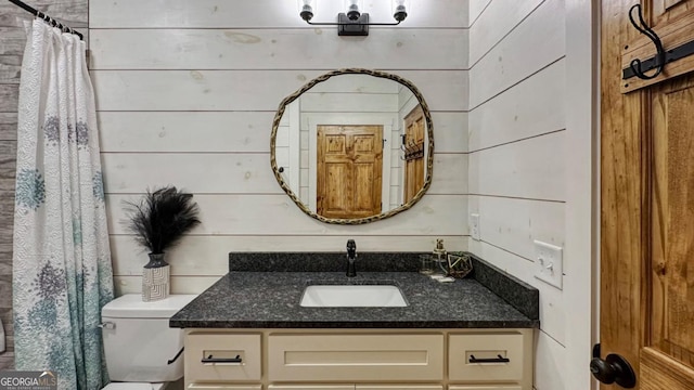 360 Prince Dr, Morganton, GA 30560 - bathroom with vanity, curtained shower, toilet, and wood walls