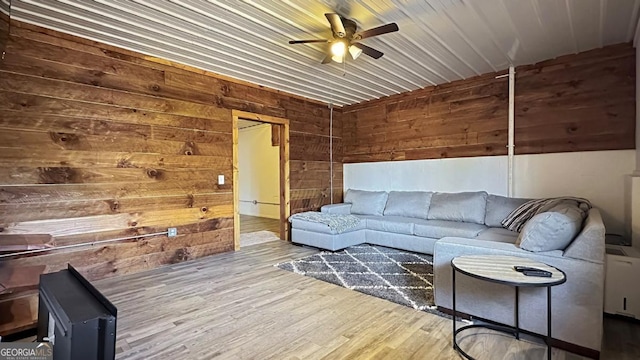 360 Prince Dr, Morganton, GA 30560 - living room featuring wood walls, ceiling fan, and wood finished floors