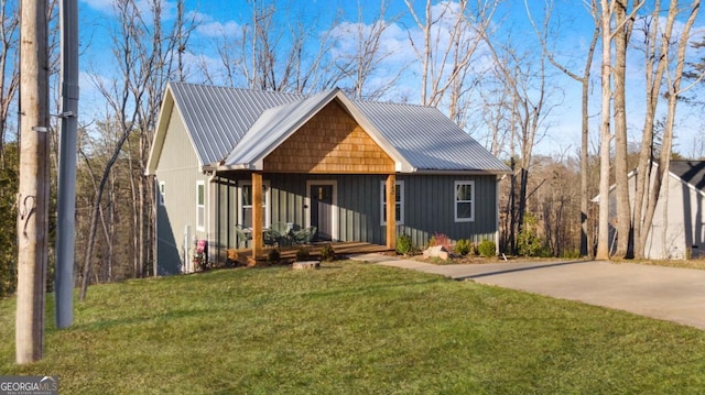 360 Prince Dr, Morganton, GA 30560 - view of front facade featuring a front lawn, covered porch, and metal roof