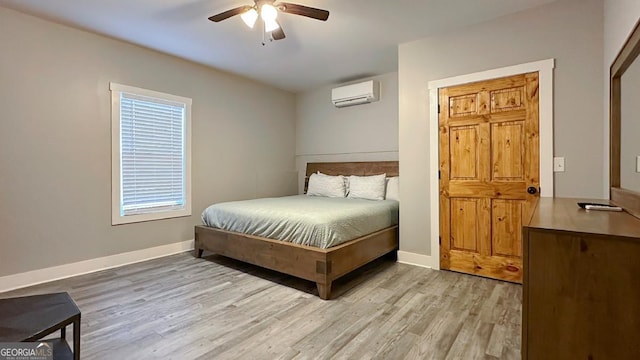 360 Prince Dr, Morganton, GA 30560 - bedroom featuring light wood finished floors, ceiling fan, baseboards, and a wall unit AC