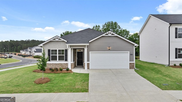 view of front facade with a garage, brick siding, a front lawn, and concrete driveway