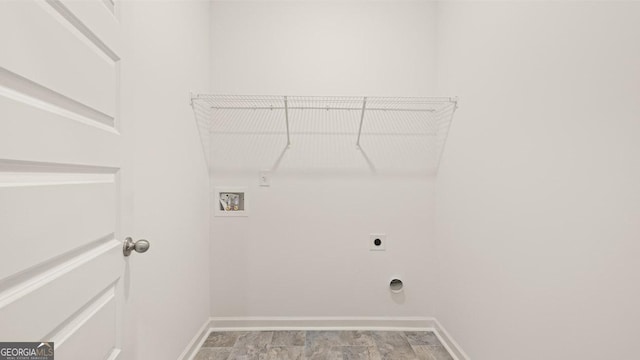 clothes washing area featuring washer hookup, baseboards, hookup for an electric dryer, and laundry area