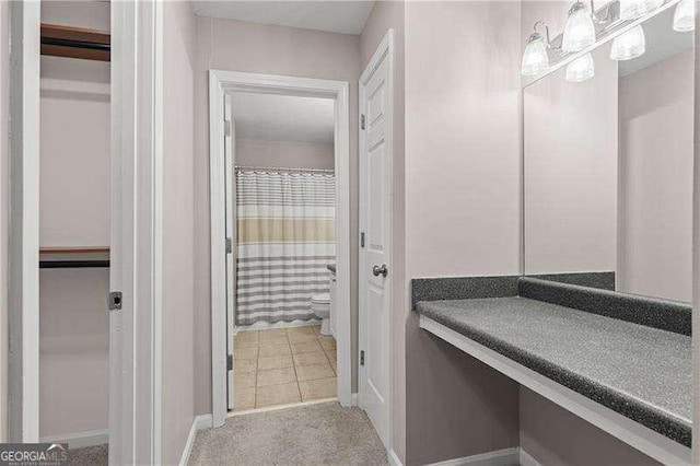 bathroom with a shower with shower curtain and toilet