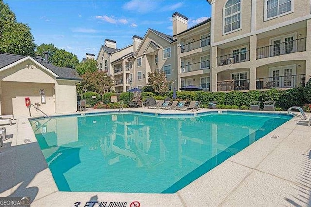 community pool with a residential view