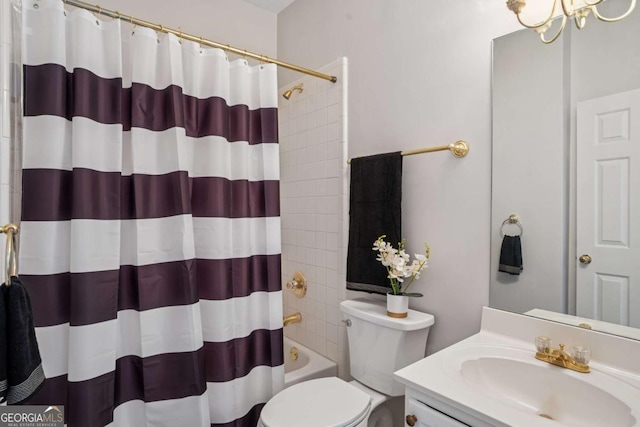 full bathroom featuring shower / tub combo with curtain, toilet, and vanity