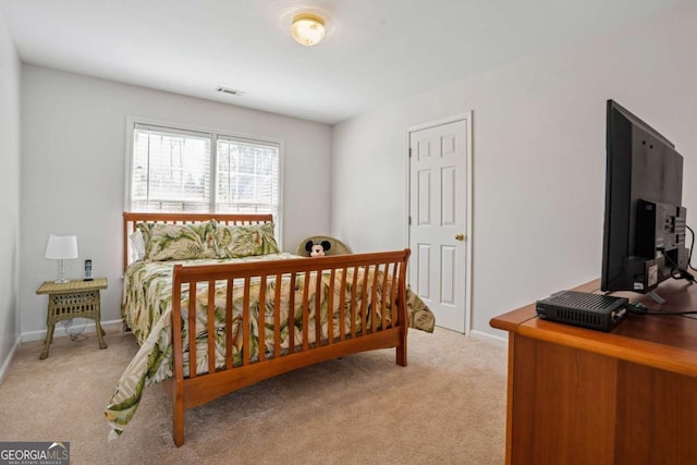 bedroom with baseboards, carpet flooring, and visible vents