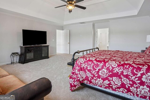 bedroom featuring baseboards, crown molding, carpet, and a raised ceiling