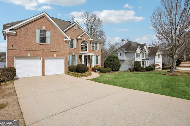 view of front of house featuring brick siding, a front yard, driveway, and a garage