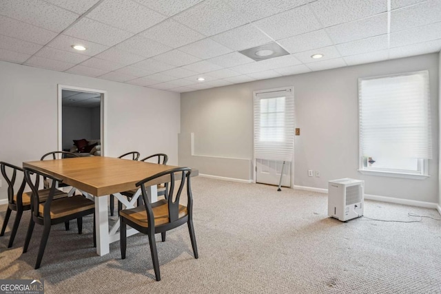 dining room featuring baseboards, carpet floors, a drop ceiling, and recessed lighting
