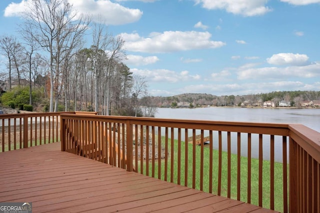 deck featuring a water view and a yard