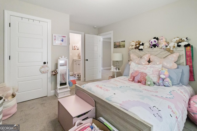 carpeted bedroom featuring connected bathroom