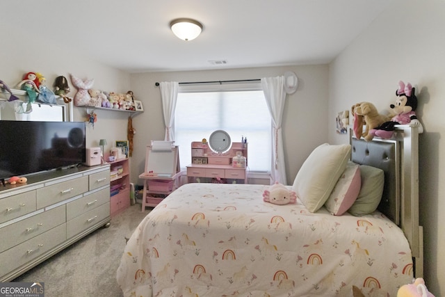 bedroom with visible vents and light colored carpet