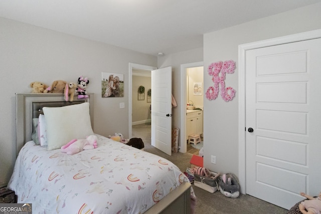 carpeted bedroom featuring ensuite bathroom