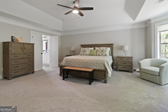 bedroom featuring crown molding, ensuite bathroom, ceiling fan, light colored carpet, and visible vents