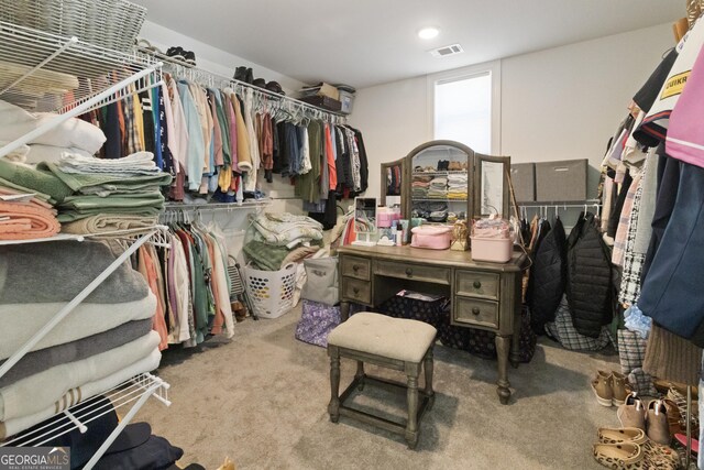spacious closet with visible vents and carpet floors