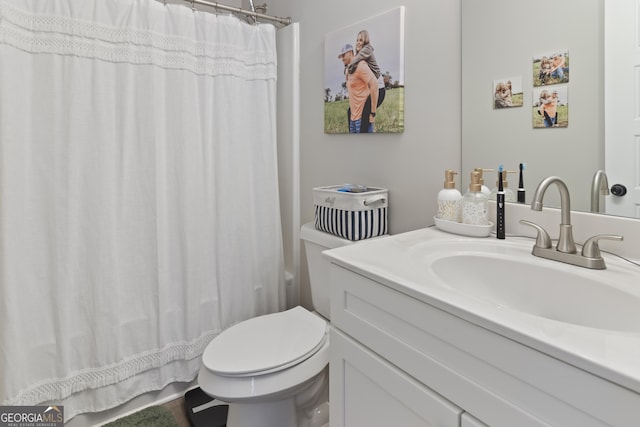 bathroom with vanity and toilet