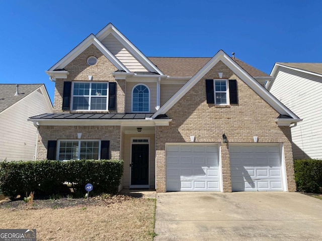 1295 Leisure Lake Dr, Lawrenceville, GA 30044 - traditional-style house featuring a shingled roof, brick siding, concrete driveway, and a standing seam roof