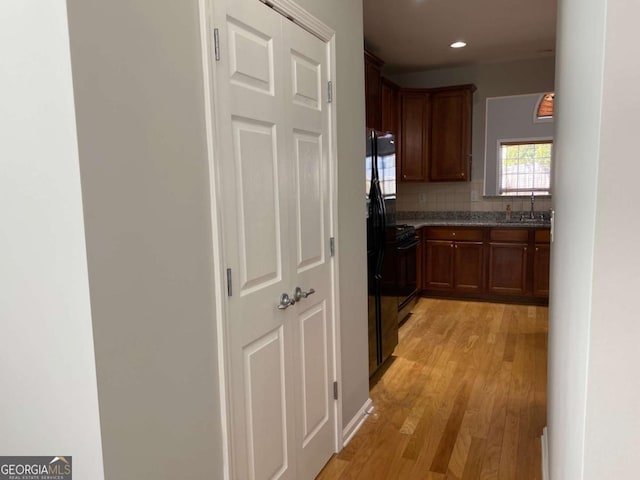 1295 Leisure Lake Dr, Lawrenceville, GA 30044 - hallway featuring recessed lighting, light wood-type flooring, and a sink