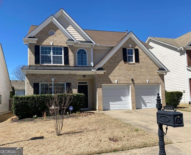 1295 Leisure Lake Dr, Lawrenceville, GA 30044 - view of front facade featuring brick siding and driveway