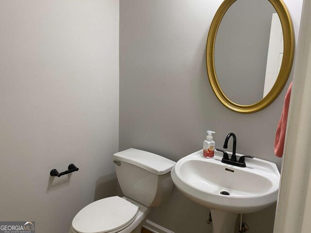1295 Leisure Lake Dr, Lawrenceville, GA 30044 - half bath with a sink and toilet