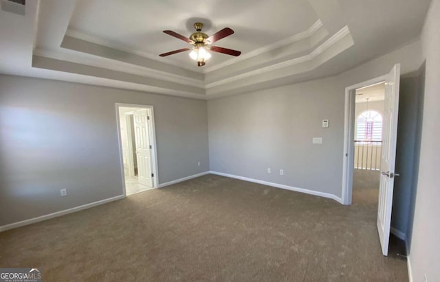 1295 Leisure Lake Dr, Lawrenceville, GA 30044 - carpeted empty room with visible vents, baseboards, ceiling fan, crown molding, and a raised ceiling