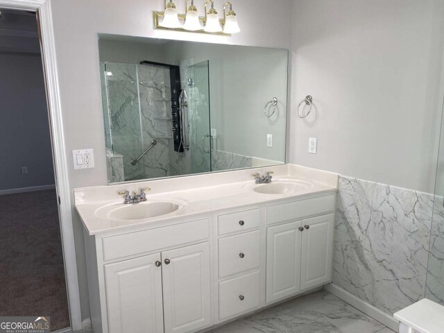 1295 Leisure Lake Dr, Lawrenceville, GA 30044 - full bathroom featuring double vanity, marble finish floor, a marble finish shower, and a sink