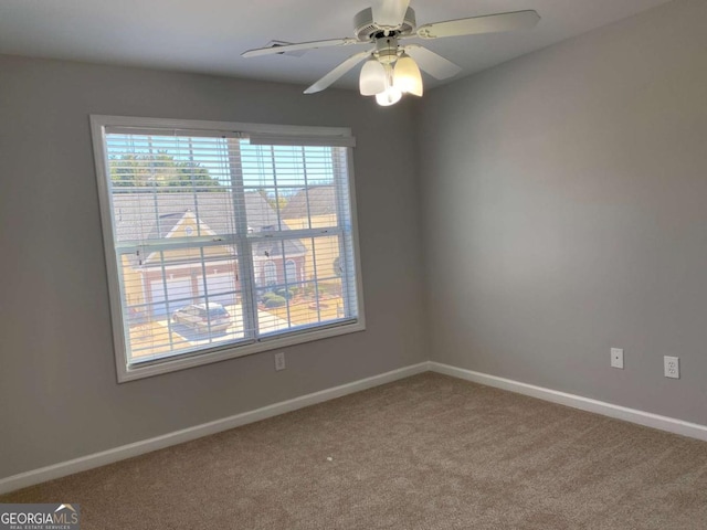 1295 Leisure Lake Dr, Lawrenceville, GA 30044 - carpeted spare room with baseboards and a ceiling fan