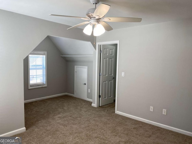 1295 Leisure Lake Dr, Lawrenceville, GA 30044 - additional living space with carpet, lofted ceiling, a ceiling fan, and baseboards