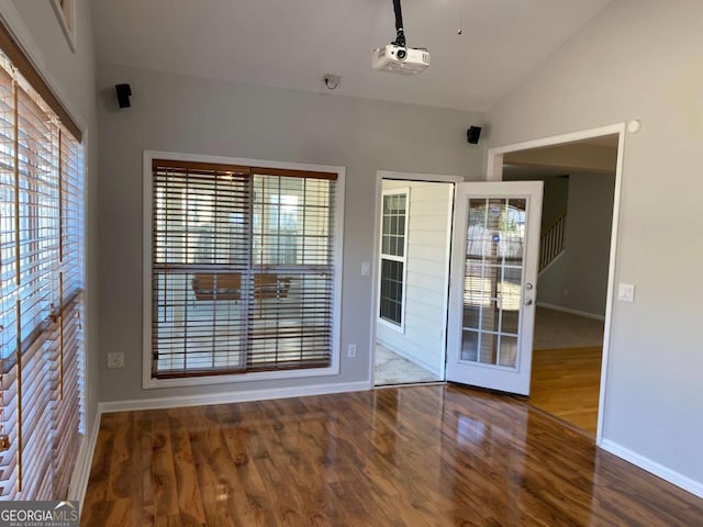 1295 Leisure Lake Dr, Lawrenceville, GA 30044 - interior space featuring baseboards, lofted ceiling, and wood finished floors